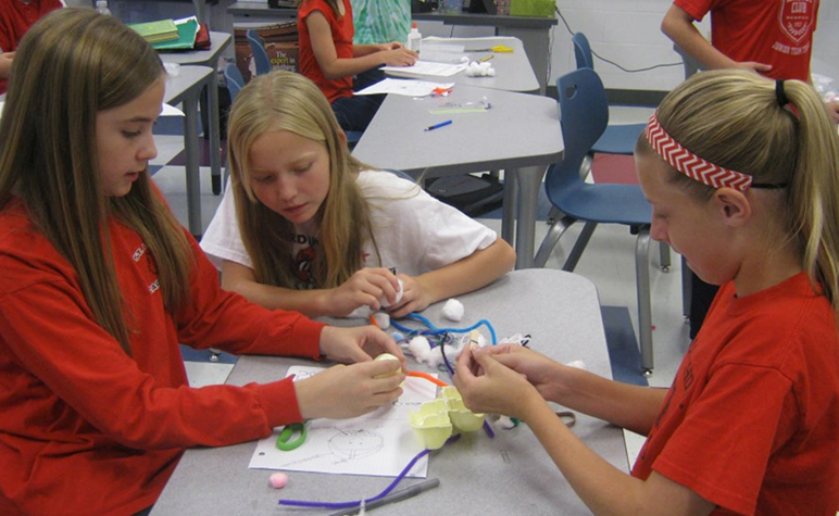 Cardinal Post October 2014: Students learning the importance of wearing a helmet through activities.